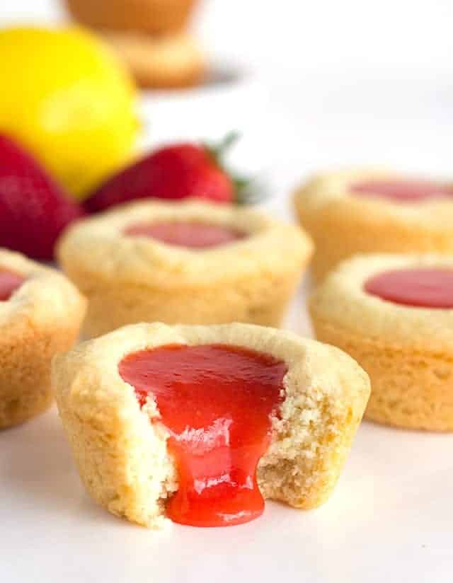 Strawberry Lemon Sugar Cookie Cups - tender sugar cookies baked in a cupcake tin. They're filled with a sweet and tangy strawberry lemon curd and make the perfect summertime cookie!