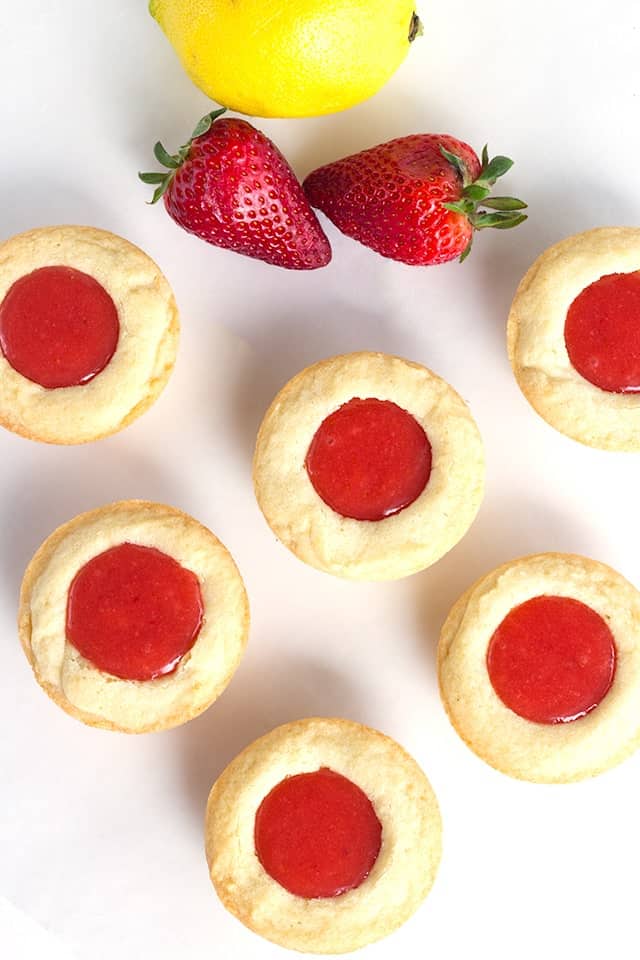 Strawberry Lemon Sugar Cookie Cups - tender sugar cookies baked in a cupcake tin. They're filled with a sweet and tangy strawberry lemon curd and make the perfect summertime cookie!