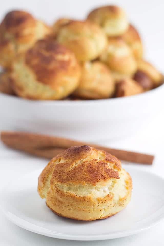 Churro Cream Puffs - easy cream puffs topped with cinnamon and sugar and filled with a cinnamon whipped cream.