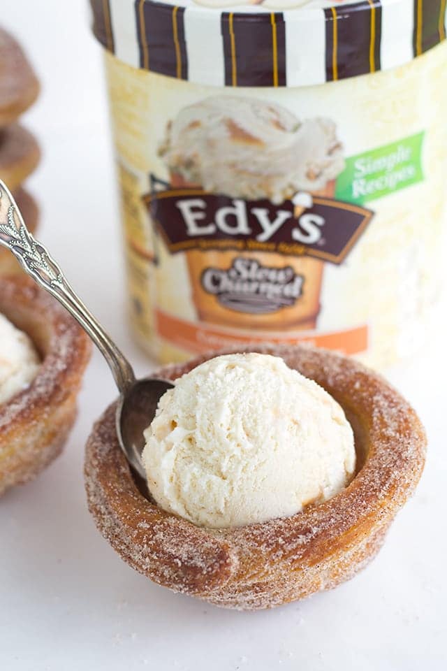 Churro Ice Cream Cups that are easy to make and fun to eat! They're piped on cupcake tins for the perfect serving size and baked, not fried, so they're a little better for you. They're perfect for summer parties and everyone eats their cup so no dirty dishes. 