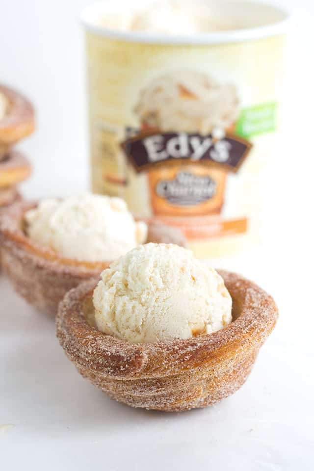Churro Ice Cream Cups that are easy to make and fun to eat! They're piped on cupcake tins for the perfect serving size and baked, not fried, so they're a little better for you. They're perfect for summer parties and everyone eats their cup so no dirty dishes.