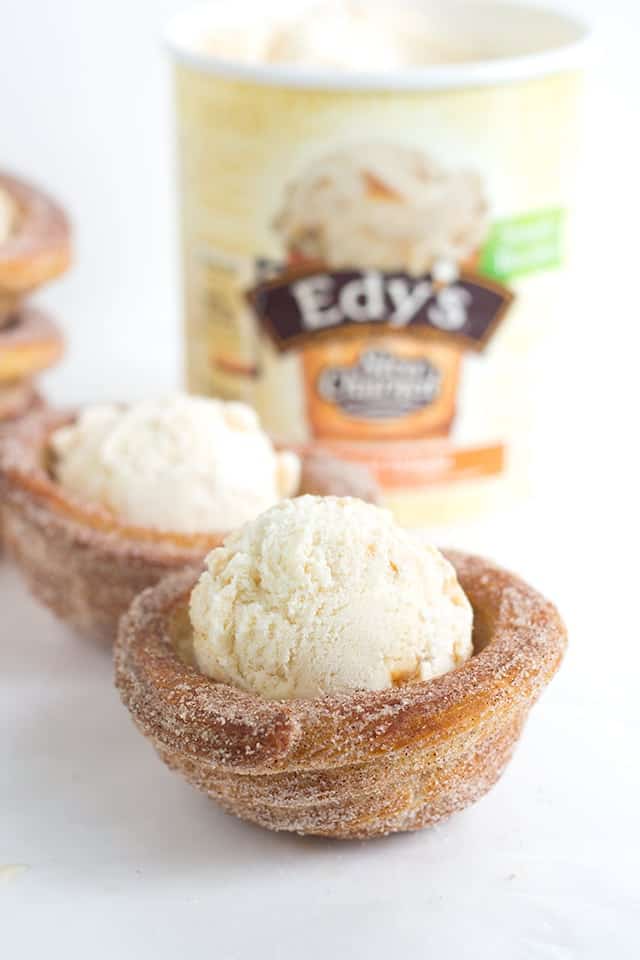 Churro Ice Cream Cups that are easy to make and fun to eat! They're piped on cupcake tins for the perfect serving size and baked, not fried, so they're a little better for you. They're perfect for summer parties and everyone eats their cup so no dirty dishes. 