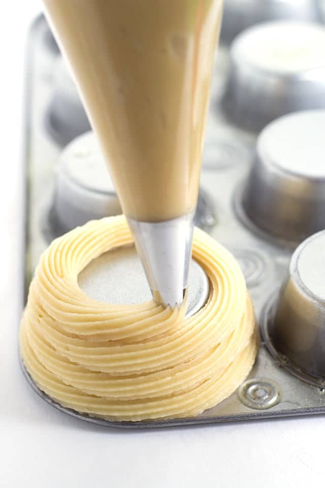 Churro Ice Cream Cups that are easy to make and fun to eat! They're piped on cupcake tins for the perfect serving size and baked, not fried, so they're a little better for you. They're perfect for summer parties and everyone eats their cup so no dirty dishes. Churro Ice Cream Cups that are easy to make and fun to eat! They're piped on cupcake tins for the perfect serving size and baked, not fried, so they're a little better for you. They're perfect for summer parties and everyone eats their cup so no dirty dishes.