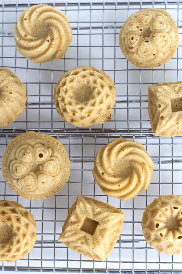 Mini Coffee and Cream Cakes - Moist little coffee flavored cakes with a vanilla butter glaze poured over top.