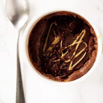 Chocolate Peanut Butter Mug Cake - quick and easy chocolate peanut butter cake made in a mug and microwaved! It's the perfect little treat to satisfy any sweet tooth.