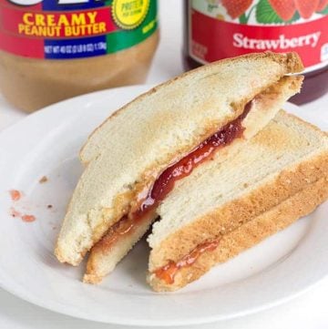 Toasted Peanut Butter and Jelly Sandwich - peanut butter, jam, butter, and two slices of toasted bread thrown together to make the perfect lunch sandwich.