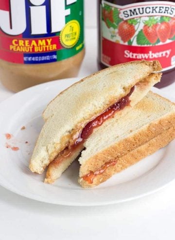 Toasted Peanut Butter and Jelly Sandwich - peanut butter, jam, butter, and two slices of toasted bread thrown together to make the perfect lunch sandwich.