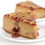 Peanut Butter and Jelly Cheesecake - rich, peanut butter cheesecake with pockets of jam throughout it! Jazz the top up with jelly and a drizzle of peanut butter!