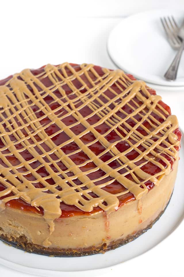 peanut butter and jelly cheesecake on a white plate