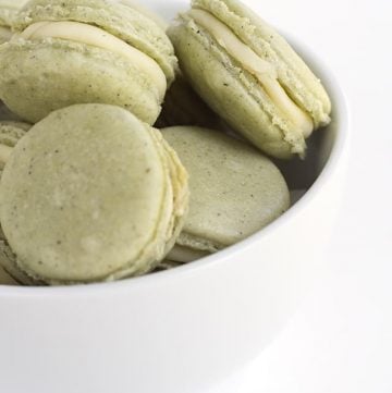 Green Tea French Macarons - delicious tea flavored french macarons with a roasted green tea infused white chocolate ganache filling. Don't worry about buying matcha powder either!