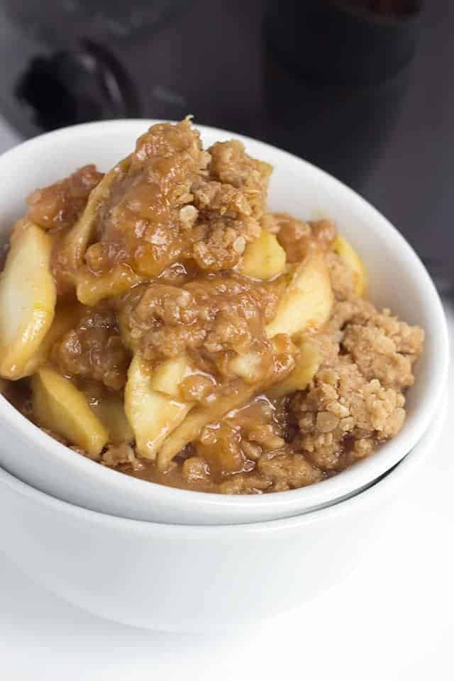 bowl of slow cooker apple peanut butter crisp