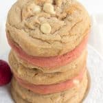 Strawberry Cheesecake Cookies - Tender white chocolate chip strawberry pudding cookies stuffed with a strawberry cheesecake filling.