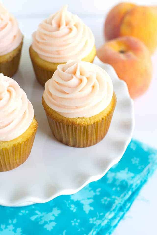 Yellow cupcakes on a cake plate