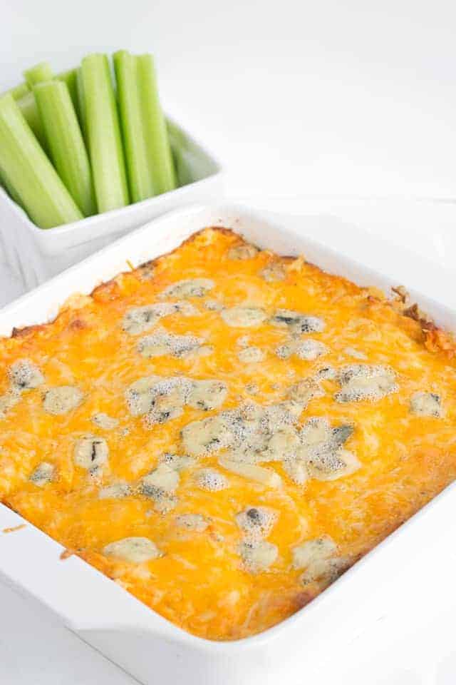 A cheesy casserole dish with buffalo chicken dip.