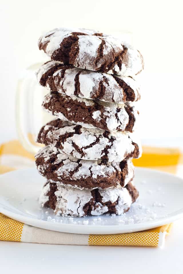 Stick of chocolate crinkle cookies on white plate