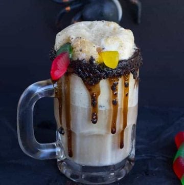 Dirt Cake Root Beer Float - The perfect spooky float for the kids! It has all the great flavors of the original float with a twist of chocolate cookie, chocolate syrup, and gummi worms!