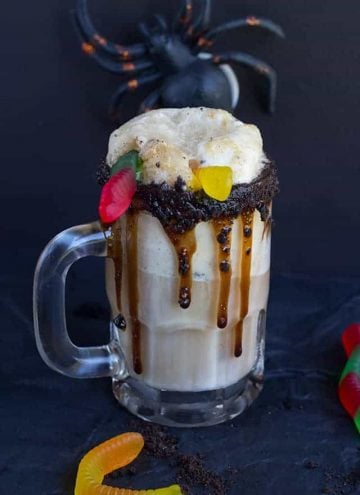 Dirt Cake Root Beer Float - The perfect spooky float for the kids! It has all the great flavors of the original float with a twist of chocolate cookie, chocolate syrup, and gummi worms!