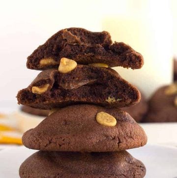 A stack of peanut butter chocolate cookies on a plate.