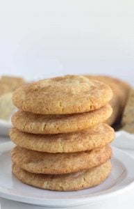 Pumpkin Cheesecake Snickerdoodles - These cookies are the perfect shortcut cookies for a holiday cookie tray.. They are stuffed with a creamy pumpkin cheesecake filling that adds an additional bit of flavor! The outside is slightly crunchy from the cinnamon sugar coating.