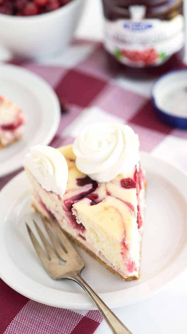 Cranberry Red Currant Cheesecake - Creamy vanilla cheesecake with swirls of cranberry and red currant throughout it. This cheesecake is perfect for the holidays!