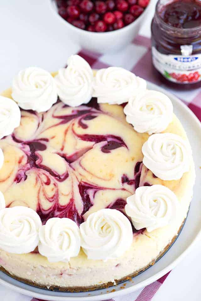 Cranberry Red Currant Cheesecake - Creamy vanilla cheesecake with swirls of cranberry and red currant throughout it. This cheesecake is perfect for the holidays!