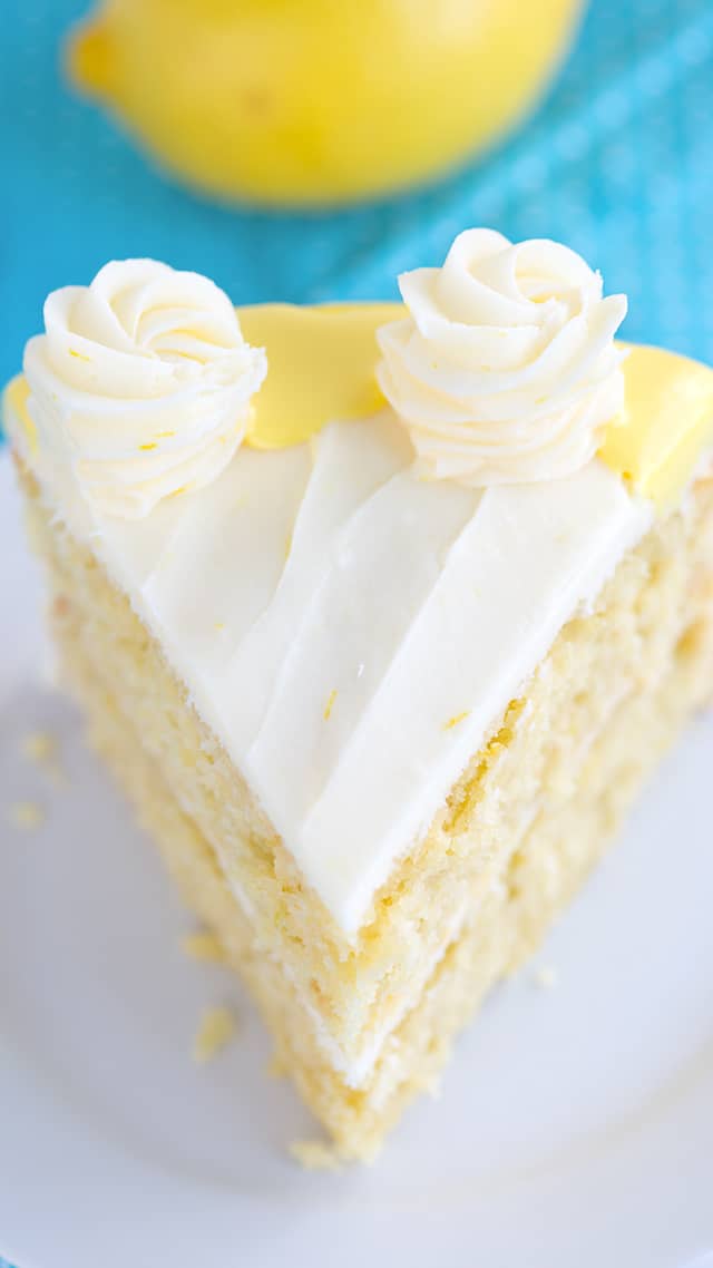 overhead photo - slice of lemon olive oil cake with cream cheese frosting