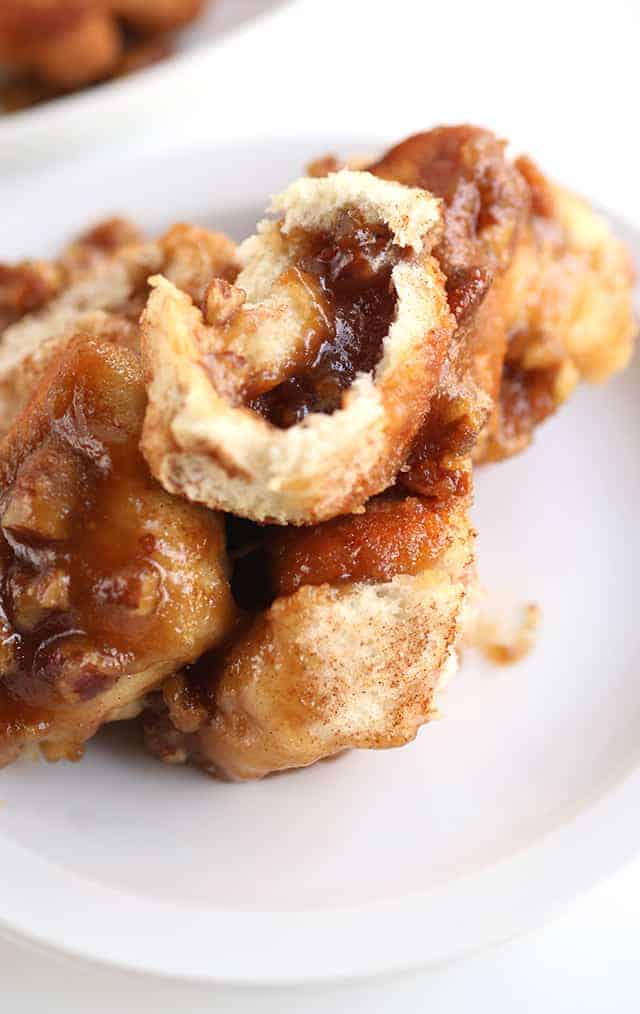 Pecan Pie Monkey Bread - grab some store bought biscuits and stuffed them with a gooey pecan pie filling! This monkey bread makes the perfect breakfast or dessert!