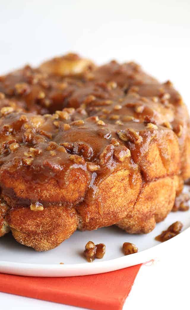 Pecan Pie Monkey Bread - grab some store bought biscuits and stuffed them with a gooey pecan pie filling! This monkey bread makes the perfect breakfast or dessert!