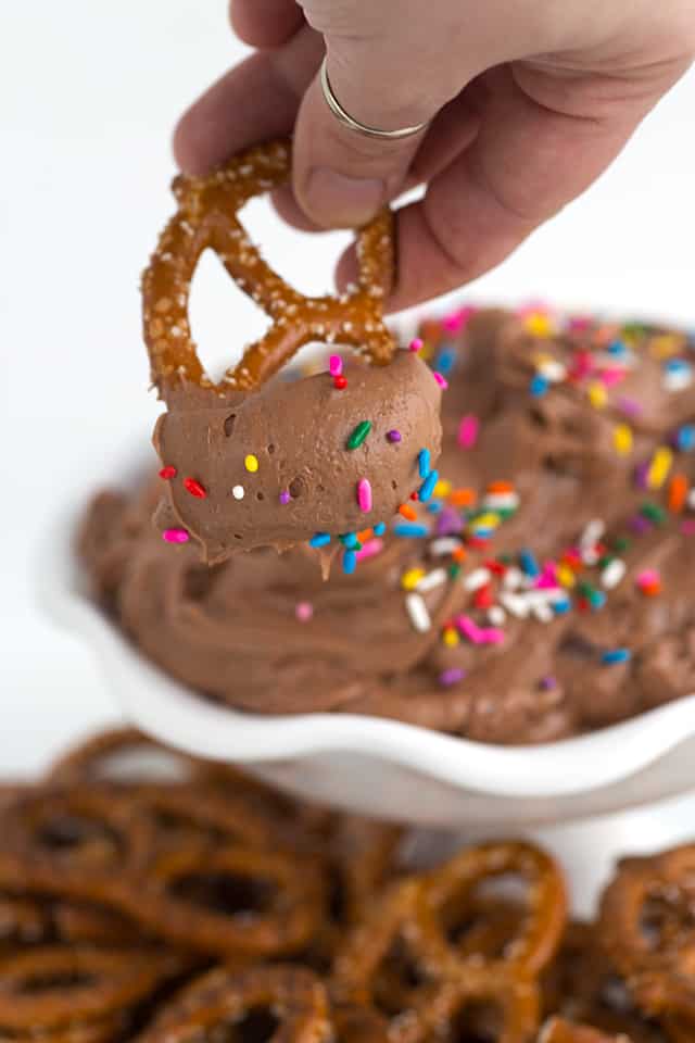 dipping pretzels into sweet brownie batter dessert dip