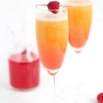 peach raspberry bellini with a raspberry syrup