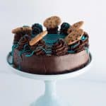 Cookie Monster Cheesecake on a blue cake plate