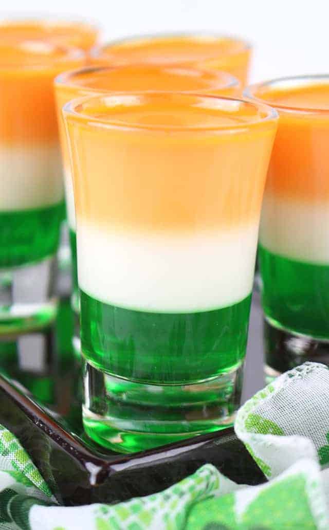 Close up photo of the St. Patrick's Day Jello Shots on a black plate. 