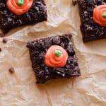 Three Carrot Patch Brownies on a paper.