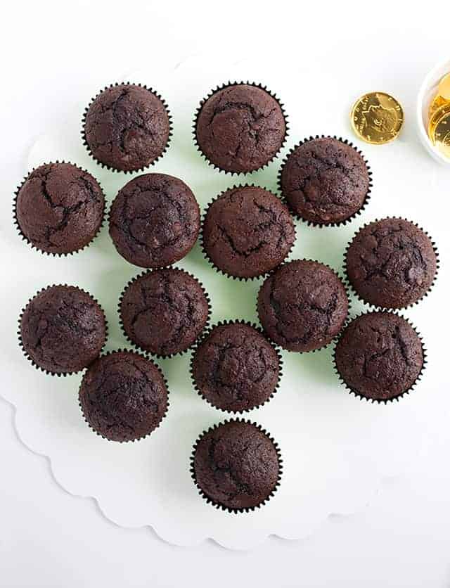 Unfrosted chocolate cupcakes laid out for the shamrock cupcake cake.