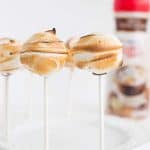 Toasted Marshmallow Mocha Truffles on a stick with a white plate holding them