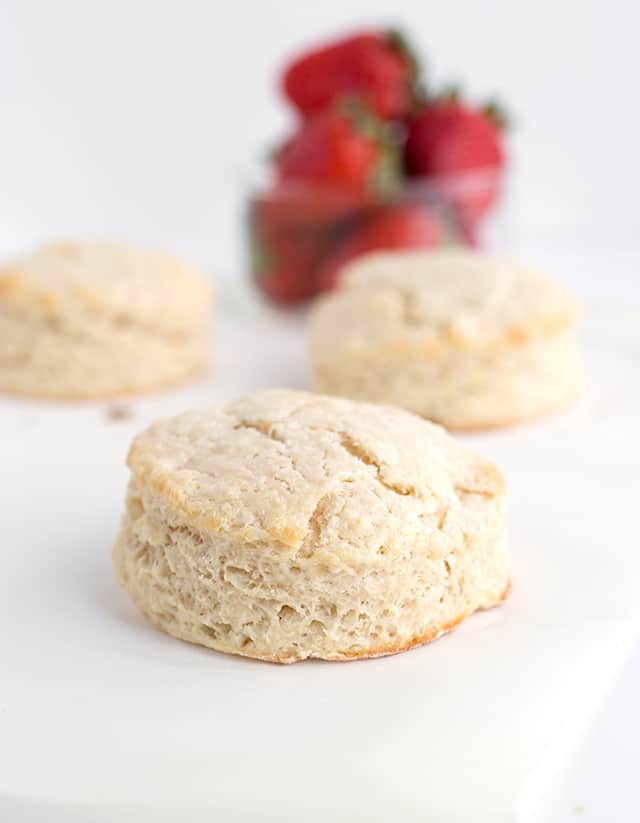 Homemade Strawberry Shortcake Recipe - Warm summer days are coming and this is the perfect cool, refreshing dessert to finish a day with. They're made with homemade sweetened buttermilk biscuits, fresh whipped cream, and macerated fresh strawberries. #cookiedoughandovenmitt #summerdessert #strawberries #dessertrecipes #dessertfoodrecipes