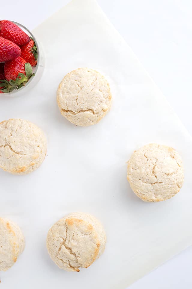 Homemade Strawberry Shortcake Recipe - Warm summer days are coming and this is the perfect cool, refreshing dessert to finish a day with. They're made with homemade sweetened buttermilk biscuits, fresh whipped cream, and macerated fresh strawberries. #cookiedoughandovenmitt #summerdessert #strawberries #dessertrecipes #dessertfoodrecipes