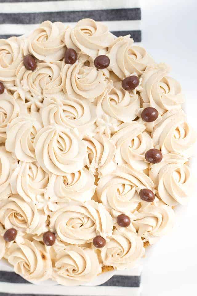 Frozen Coffee Cream Pie - Start summer off with a frozen coffee cream pie! The pie is made with a homemade cold brew coffee pudding, cream cheese, and homemade whipped cream! It’s a great pie to make ahead and then partially thaw and serve later! #pie #cookiedoughandovenmitt #coffee #frozenpie #dessertrecipes #pierecipe #dessertfoodrecipes