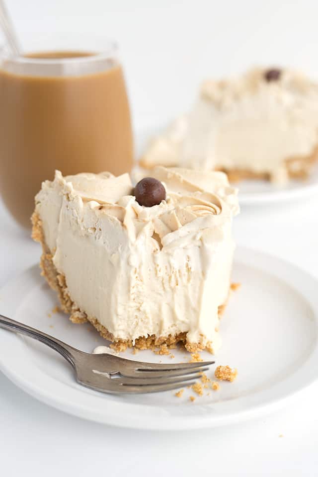 Frozen Coffee Cream Pie - Start summer off with a frozen coffee cream pie! The pie is made with a homemade cold brew coffee pudding, cream cheese, and homemade whipped cream! It’s a great pie to make ahead and then partially thaw and serve later! #pie #cookiedoughandovenmitt #coffee #frozenpie #dessertrecipes #pierecipe #dessertfoodrecipes