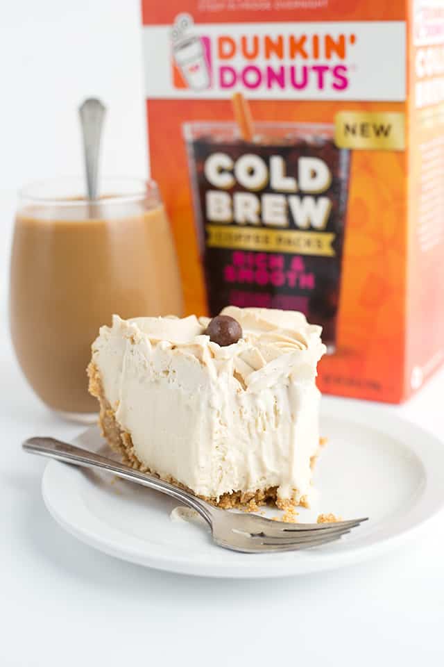 Frozen Coffee Cream Pie - Start summer off with a frozen coffee cream pie! The pie is made with a homemade cold brew coffee pudding, cream cheese, and homemade whipped cream! It’s a great pie to make ahead and then partially thaw and serve later! #pie #cookiedoughandovenmitt #coffee #frozenpie #dessertrecipes #pierecipe #dessertfoodrecipes