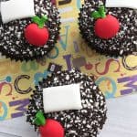 close of up 3 back to school cupcakes with the yellow paper behind it
