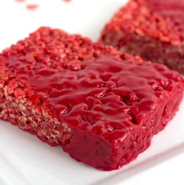 close up of bloody red velvet rice krispie treat on a white plate