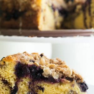A slice of Blueberry Coffee Cake on a plate.