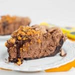 A slice of chocolate peanut butter pie on a plate.