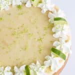 Close up overhead key lime cheesecake with white background