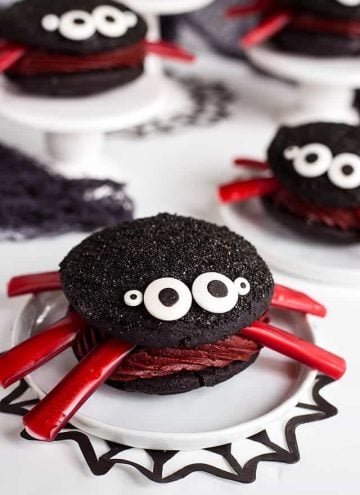 Spider Whoopie Pies on a white plate with black spider web