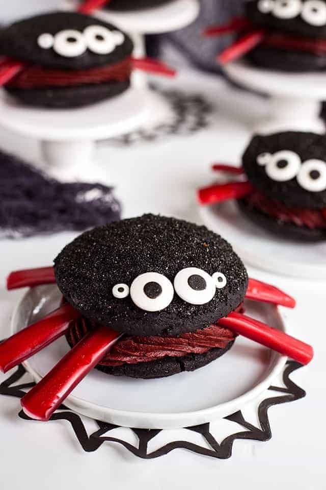 Spider Whoopie Pies on a white plate with black spider web