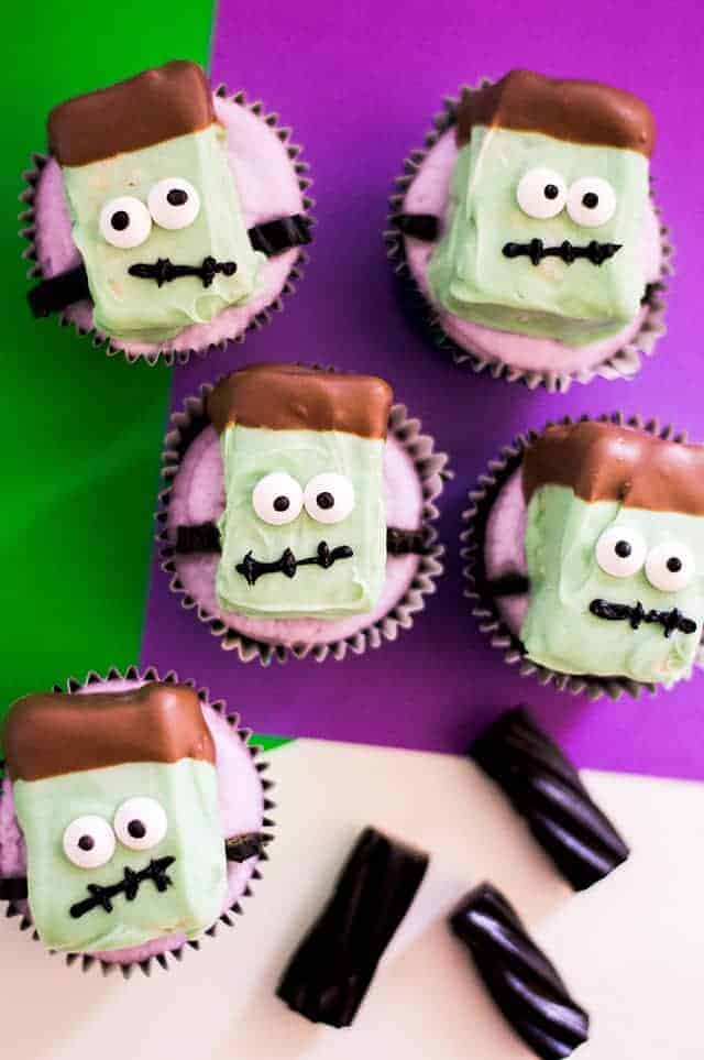 Frankenstein Cupcakes with black licorice and purple background