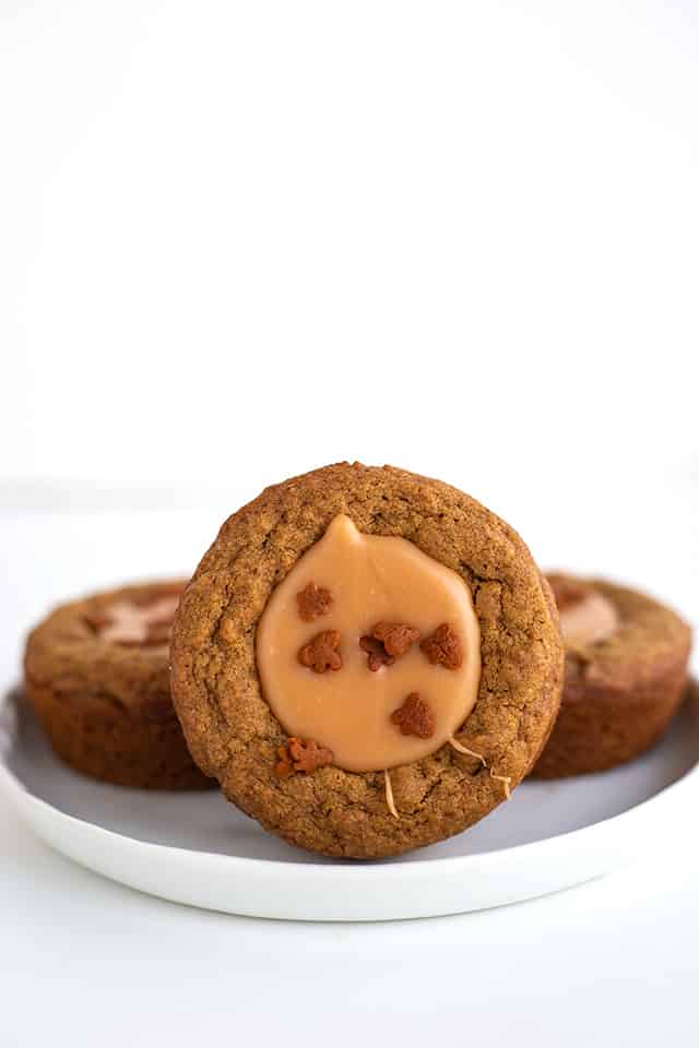 Fudge Filled Gingerbread Cookie Cups - There's nothing better than a tasty Christmas cookie this time of the year! These fudge filled gingerbread cookie cups will not disappoint. They're chewy, loaded with flavor, and filled with an easy buttered rum fudge.