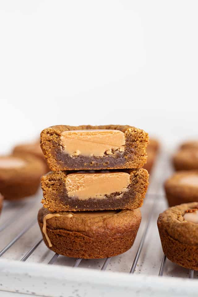 Fudge Filled Gingerbread Cookie Cups - There's nothing better than a tasty Christmas cookie this time of the year! These fudge filled gingerbread cookie cups will not disappoint. They're chewy, loaded with flavor, and filled with an easy buttered rum fudge.